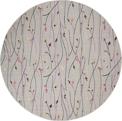 Round gray rug with abstract black, pink, and gold botanical stems and tiny buds.