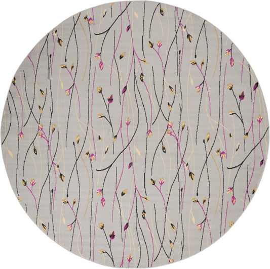 Round gray rug with abstract black, pink, and gold botanical stems and tiny buds.