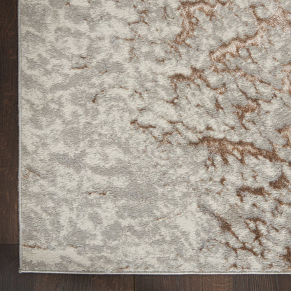 Rectangular plush area rug in pale gray with brown marbled pattern; modern abstract style for living room.