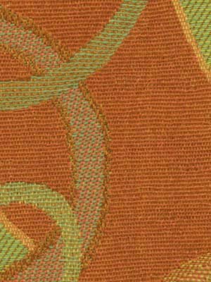 Close-up of apricot woven fabric with olive-green circular motifs; textured upholstery fabric.