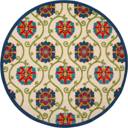 Round rug with cream backdrop, blue edge, teal-green vines and bold red, orange, teal floral medallions.