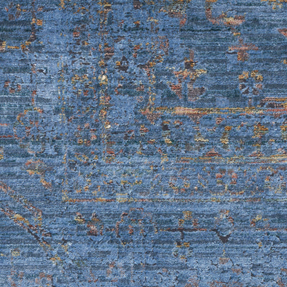 Blue distressed abstract rug with rust and gold accents; soft woven texture for living room decor.