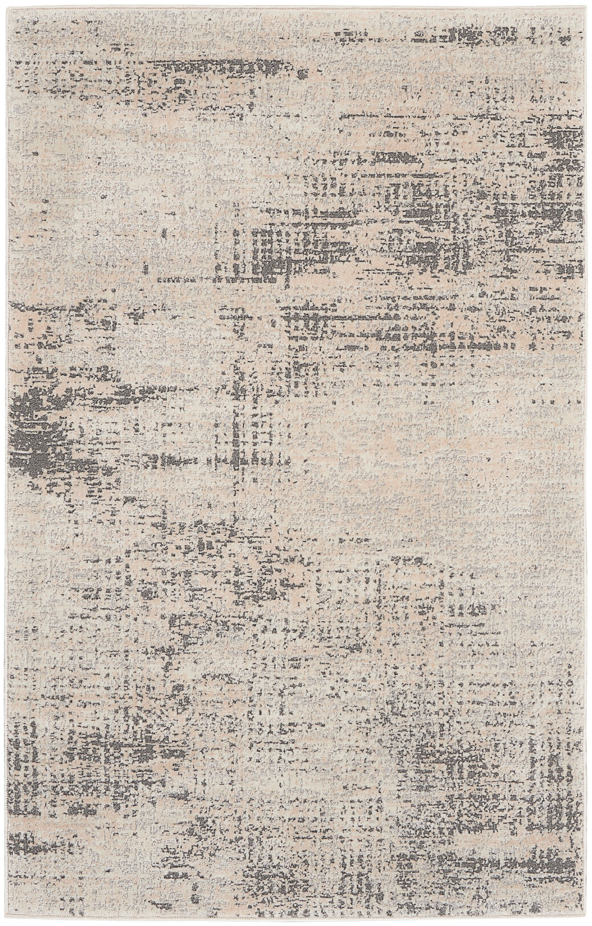 Abstract distressed beige and gray area rug with muted tonal patches for a modern living room.