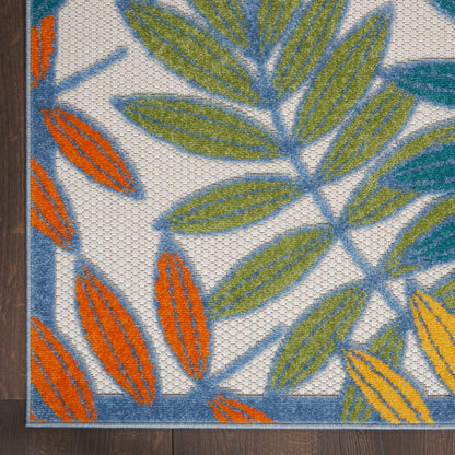 Colorful leaf-pattern rug with blue, green and orange leaves on white; woven texture, rectangular home decor.