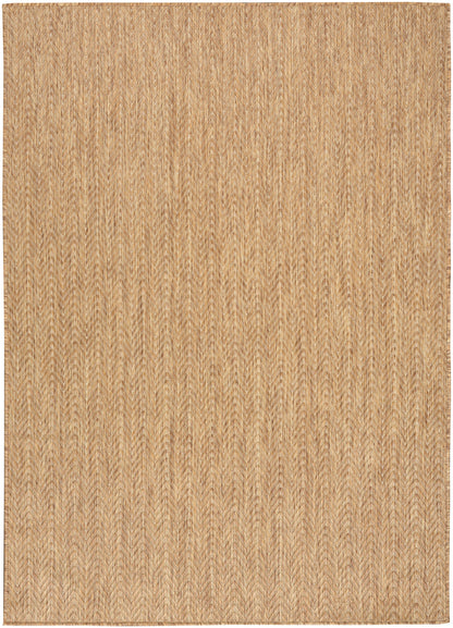 Natural tan woven jute rug with subtle chevron pattern; rectangular rug.