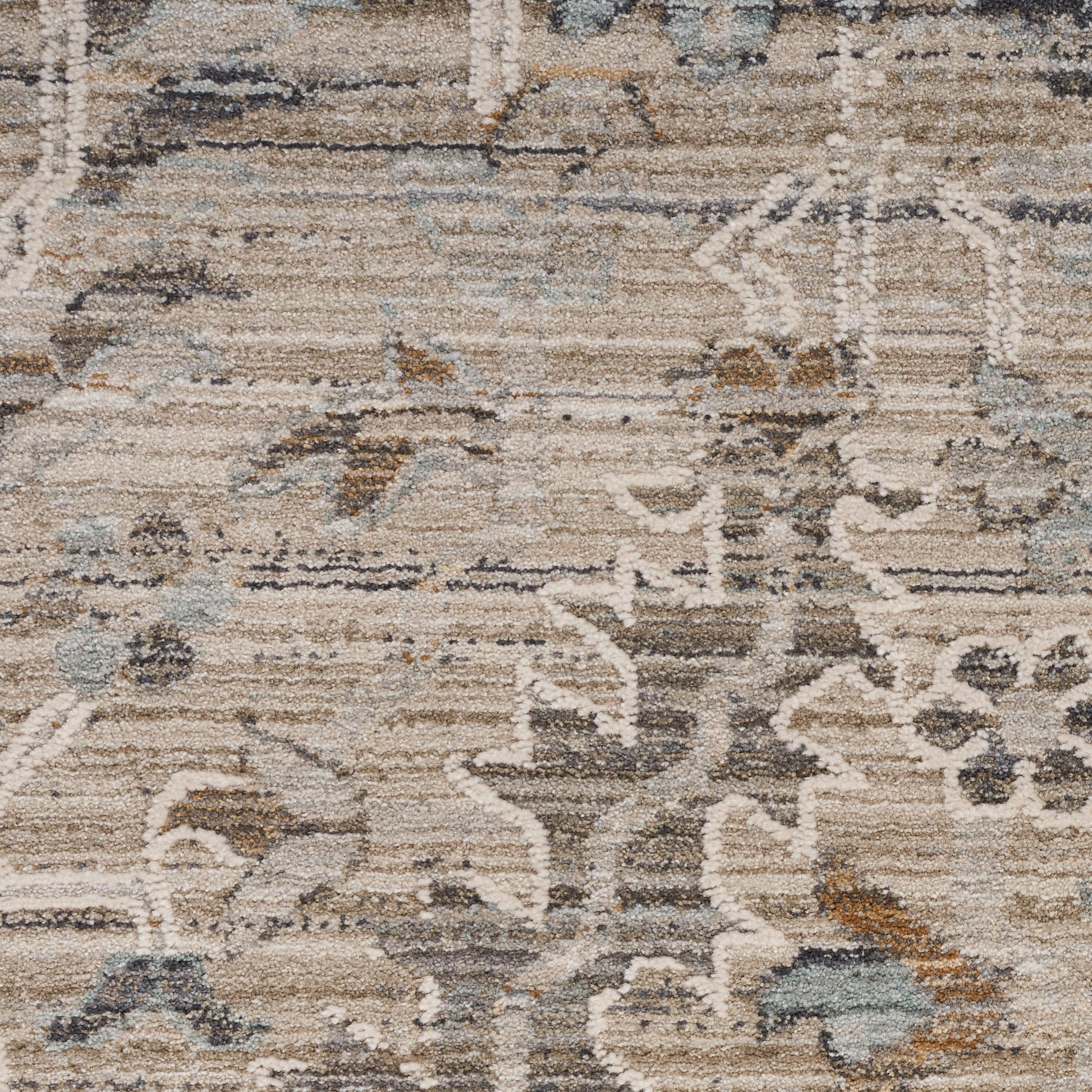 Distressed beige and blue-toned oriental area rug with floral medallion motifs.