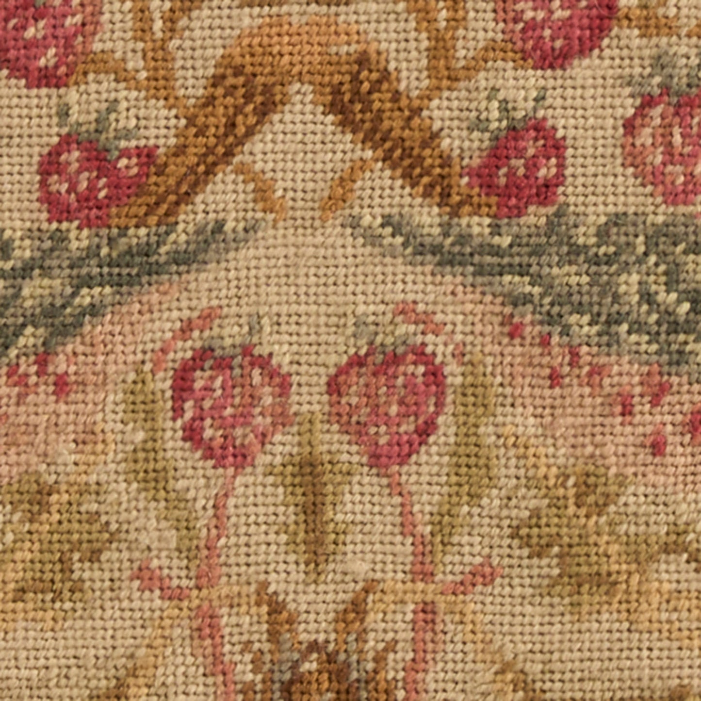 Beige woven tapestry rug with pink floral damask pattern, gold-brown scrolls and muted green accents.