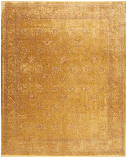 Rectangular gold-toned rug with faded floral motifs and a decorative border; warm amber color, vintage look.