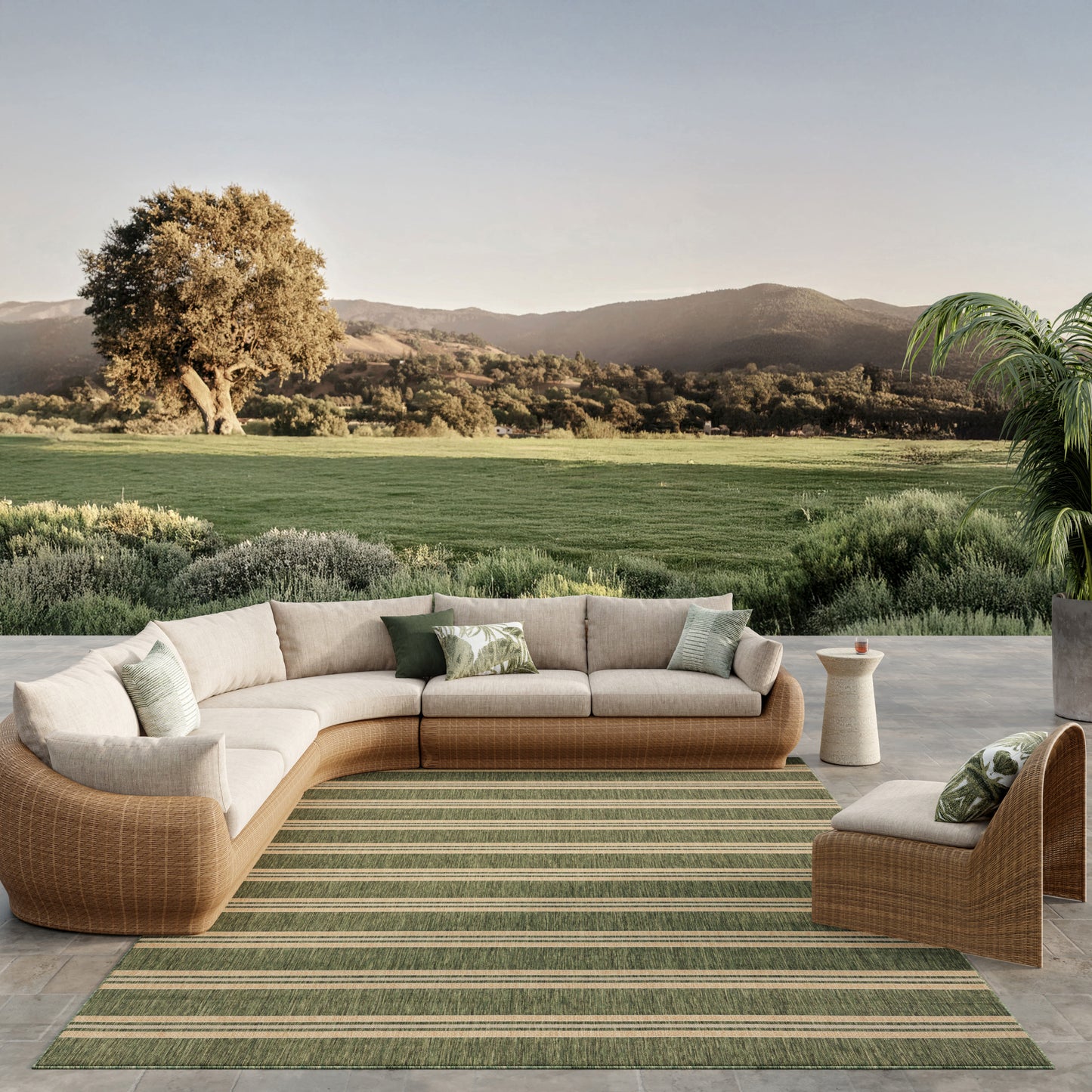 Modern area rug, 10' x 14', with a subtle pattern, set on a surface with a scenic countryside backdrop.