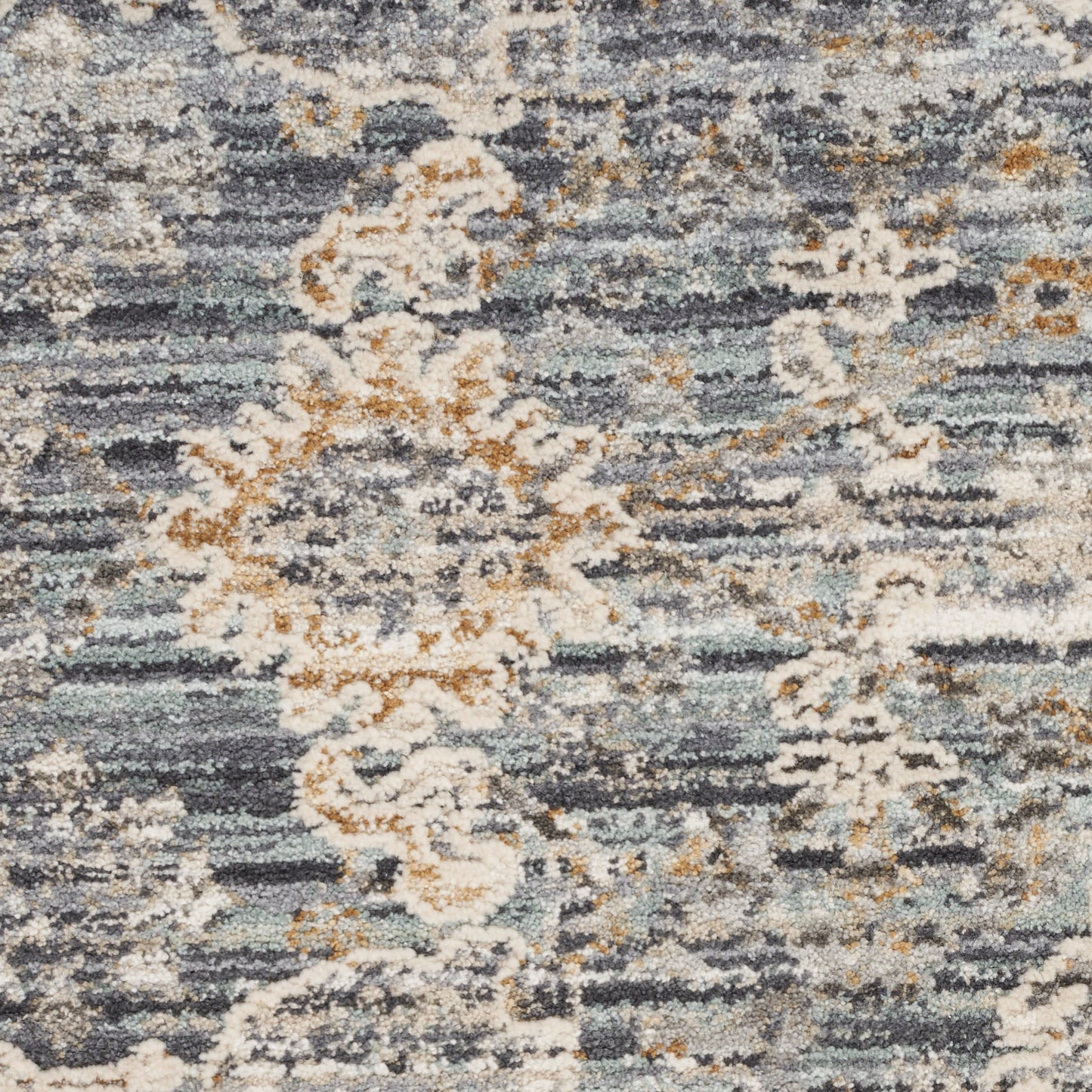 Distressed blue-gray runner rug with ivory floral medallions and gold accents.