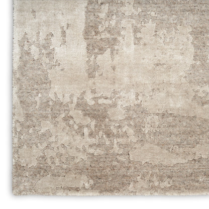 Beige distressed area rug with marble-like pattern; neutral tan & cream tones for modern rustic living spaces.