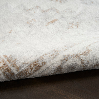 Cream shag runner with subtle beige geometric pattern, plush pile on dark wood floor.