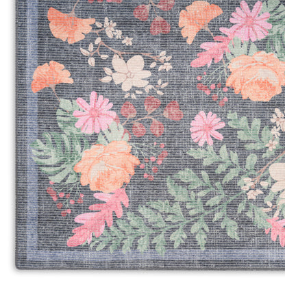 Rectangular blue-gray floral woven rug runner with peach, pink and white blossoms and green leaves; bordered.