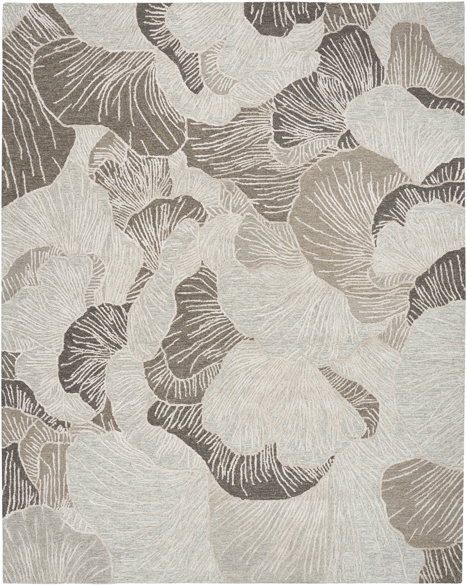 Neutral abstract leaf-pattern rug in beige, taupe and cream with textured, organic shapes.