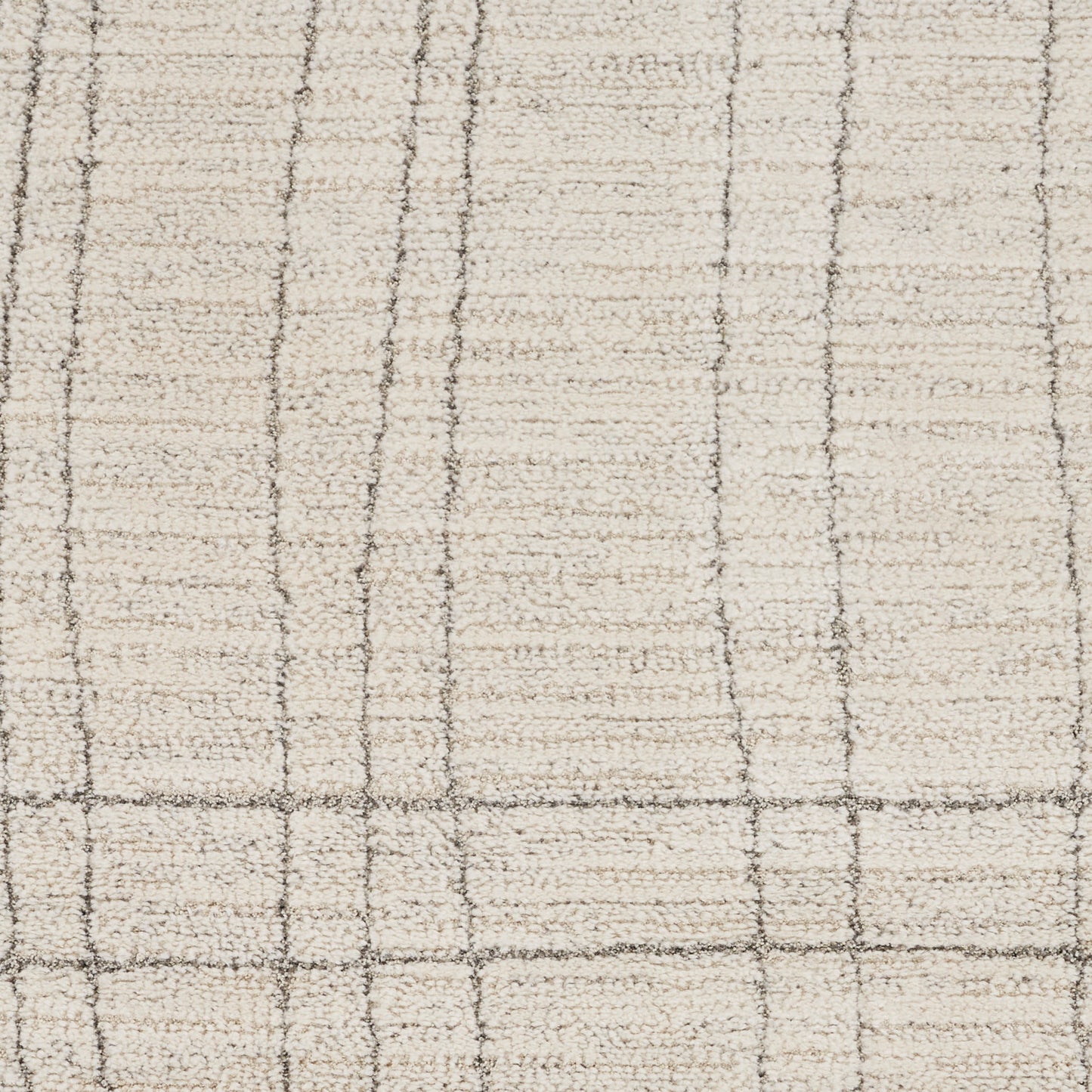 Cream rug with light brown grid lines forming squares; soft woven texture, neutral plaid style.
