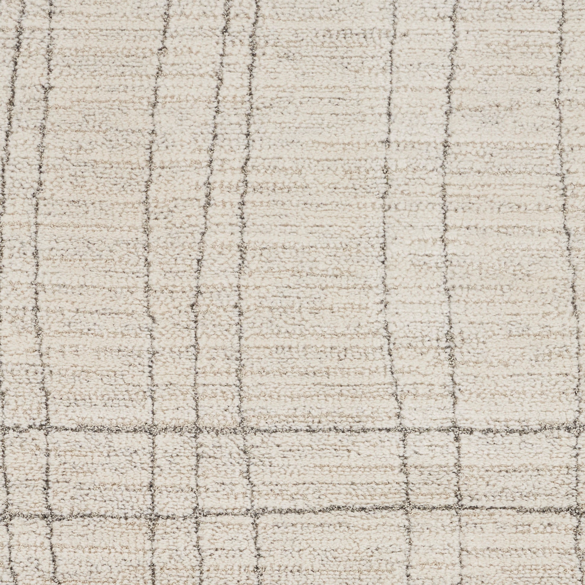 Cream rug with light brown grid lines forming squares; soft woven texture, neutral plaid style.