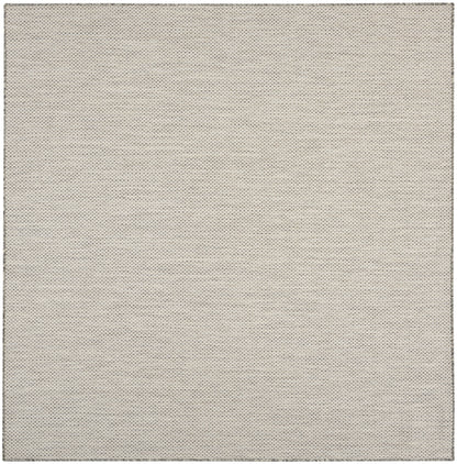 Beige textured fabric swatch with tiny dotted weave; soft upholstery & wallpaper material.
