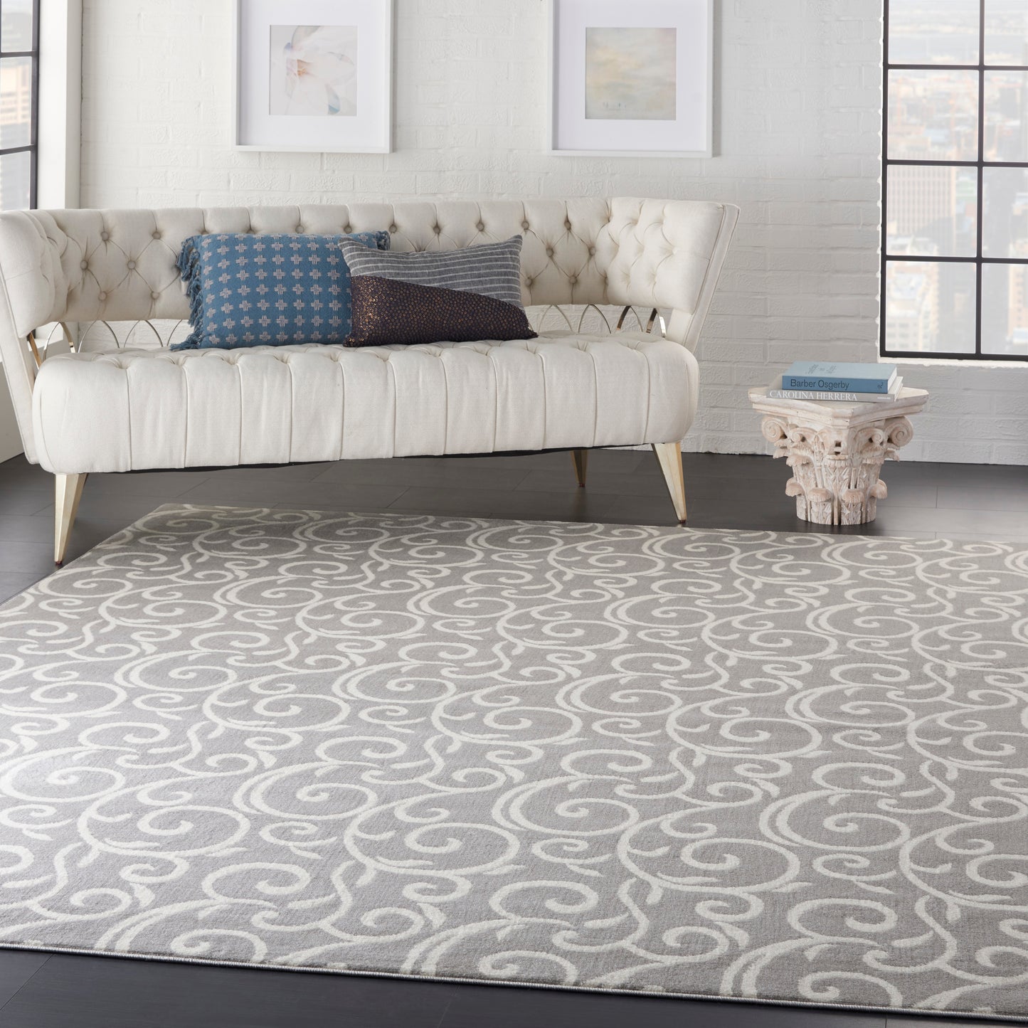 Cream and gray swirling rug in a bright living room.