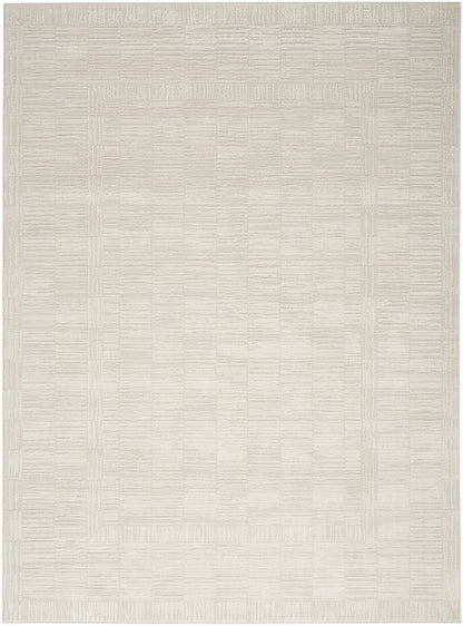 Cream woven area rug with subtle nested square border; neutral flat-weave, soft texture.