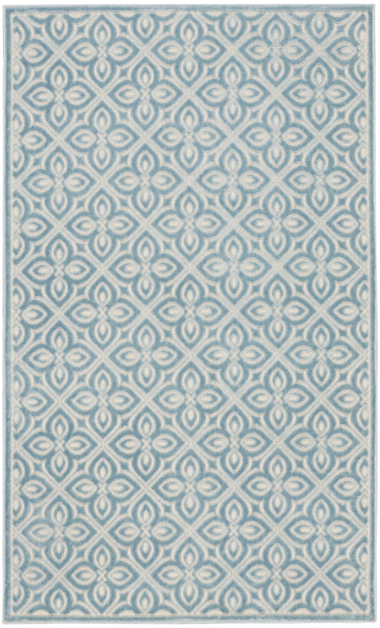 Rectangular blue and white rug with a repeating floral quatrefoil lattice pattern and a light blue border