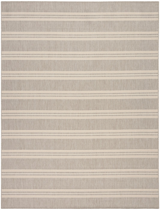 Beige textured rug with cream horizontal stripes; flat-weave, neutral coastal style.