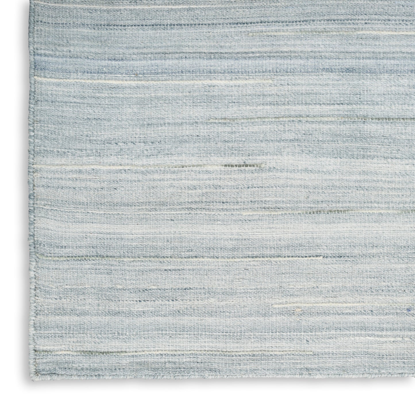 Light blue-gray woven rug with subtle horizontal stripes and soft textured finish.