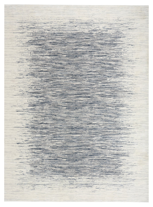 Beige rectangular rug with abstract blue-gray brush-stroke pattern and distressed, waterlike texture.