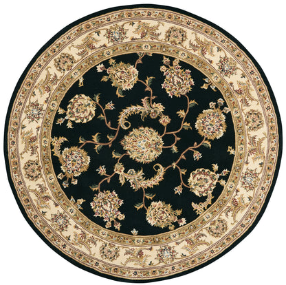 Round oriental rug with black field and cream-beige floral border; intricate scrolling bouquets.