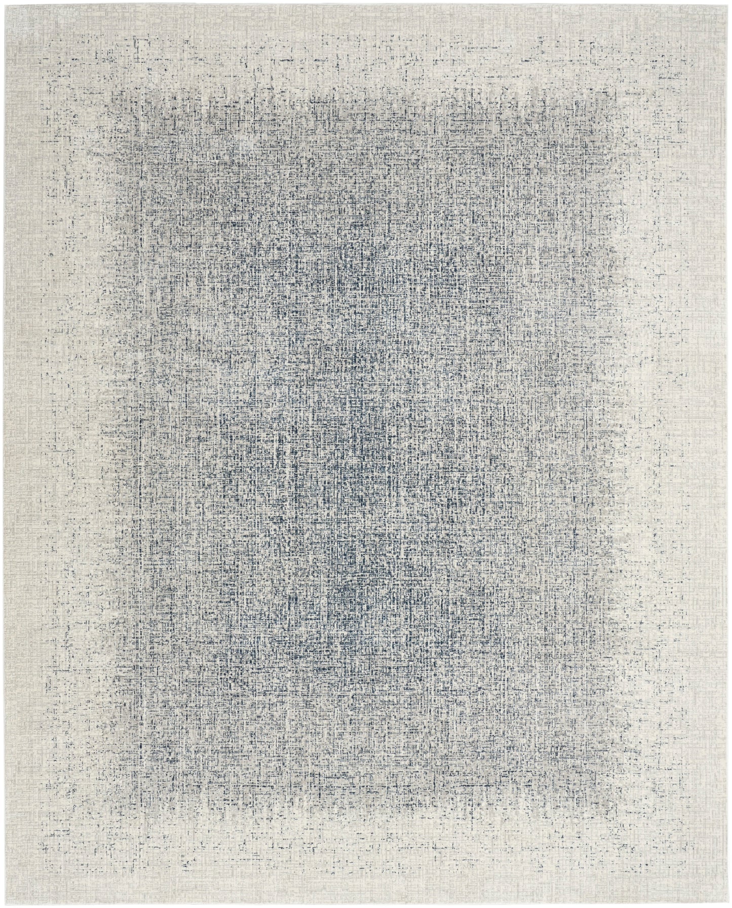 Rectangular woven area rug with a distressed blue-gray center on a cream-beige field; vintage abstract texture.
