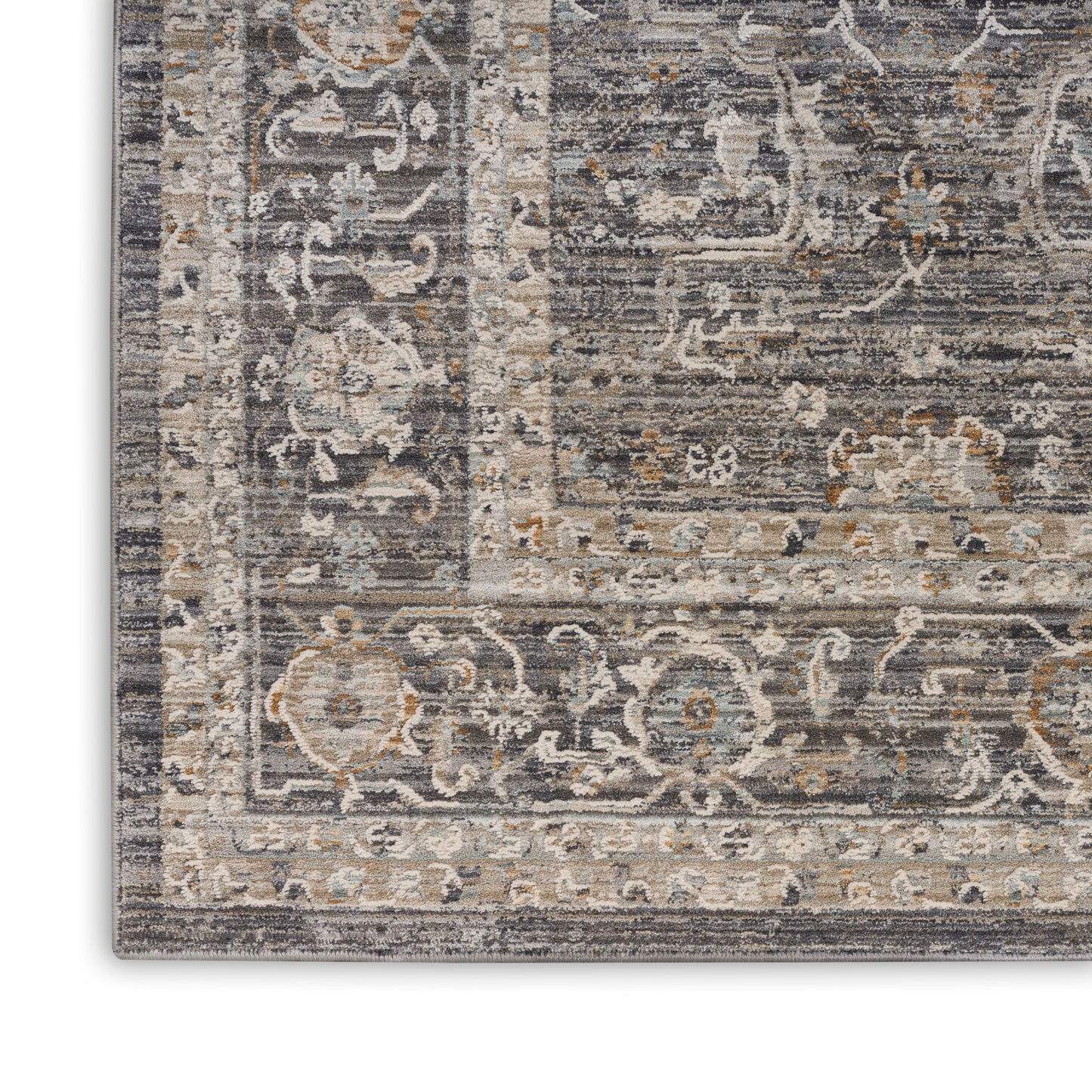 Rectangular distressed gray-beige oriental rug with ivory border, blue accents and floral motifs.