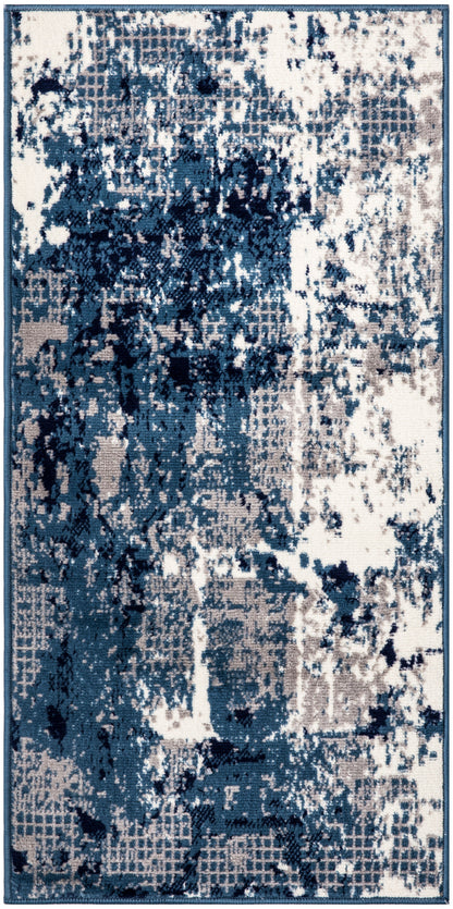 Rectangular area rug with abstract distressed pattern in navy, teal and ivory; modern contemporary style.