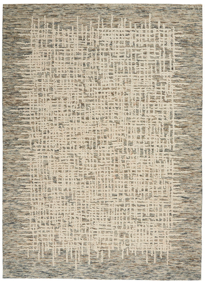 Rectangular area rug with cream ivory center and muted blue-gray border; abstract lattice grid in a distressed pattern.