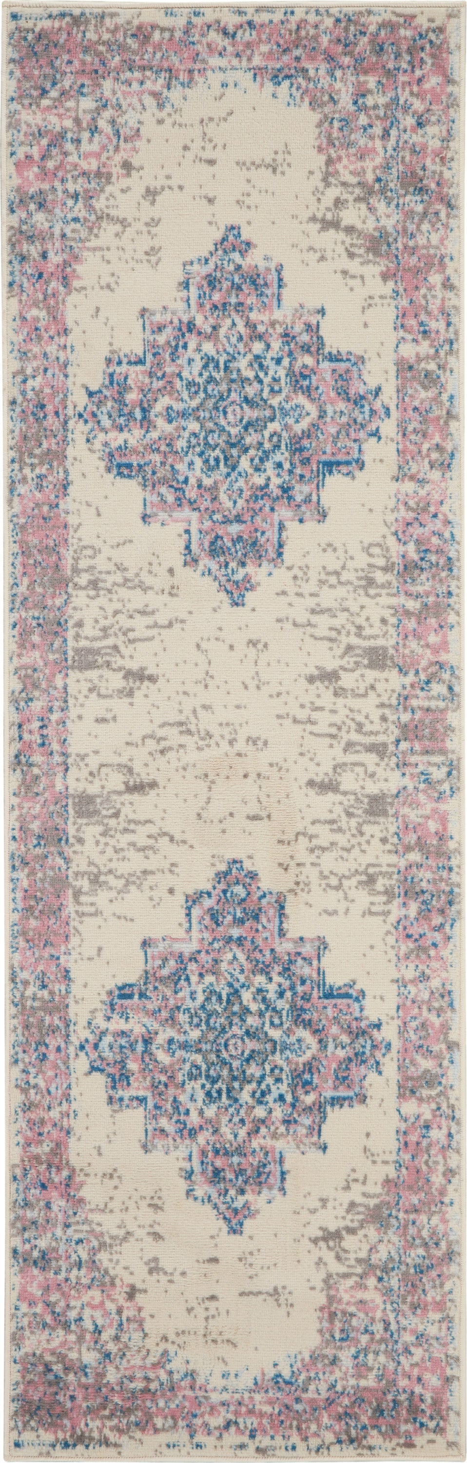 Oriental-style runner rug with cream field and two blue-pink geometric medallions, pink border.