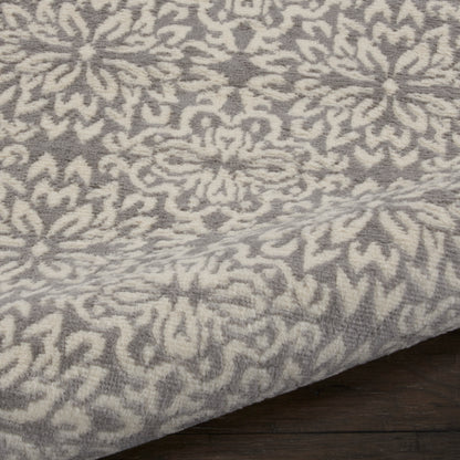 Gray and ivory damask-pattern 7' runner rug with plush woven texture on a dark wood floor.