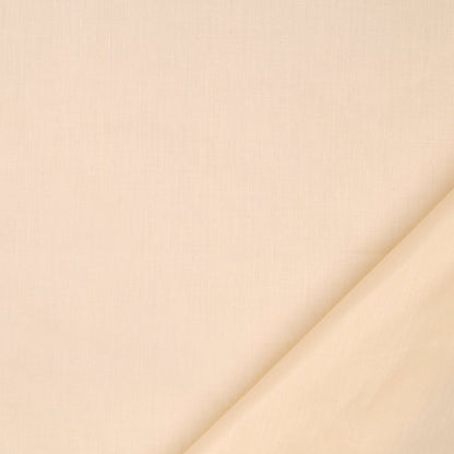 Cream fabric close-up with a diagonal fold in the bottom-right, soft neutral textile texture.