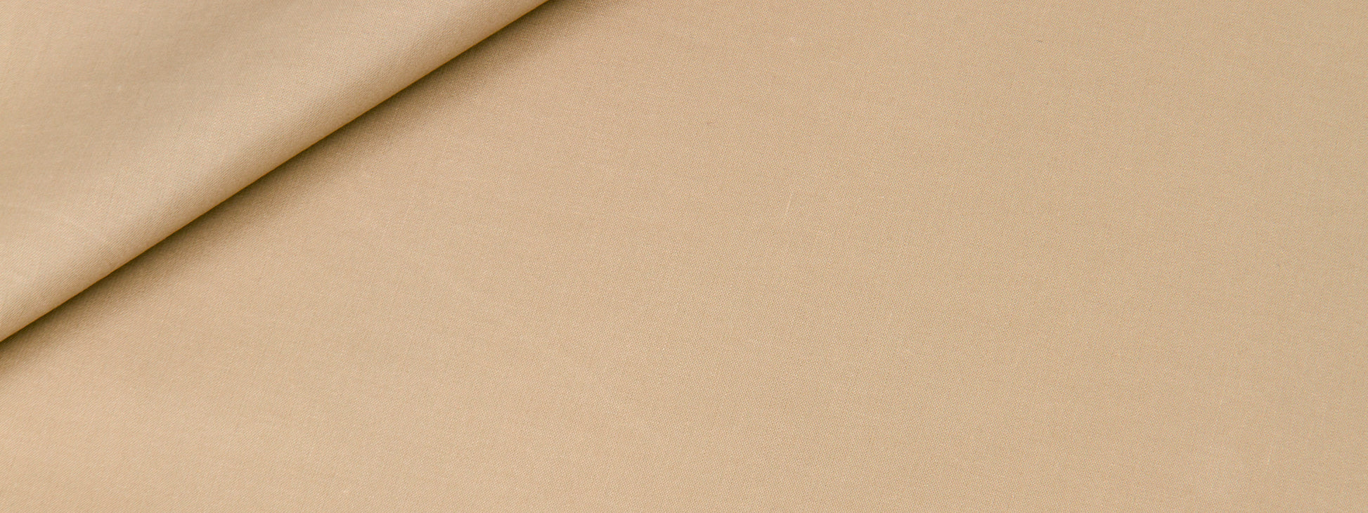 Taupe fabric with a top-left folded corner; smooth texture, multipurpose for apparel, upholstery or crafts.