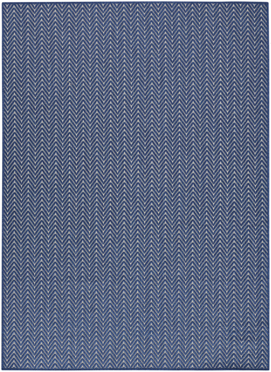 Blue and white chevron pattern rug, rectangular woven textile with zigzag design, modern coastal style.