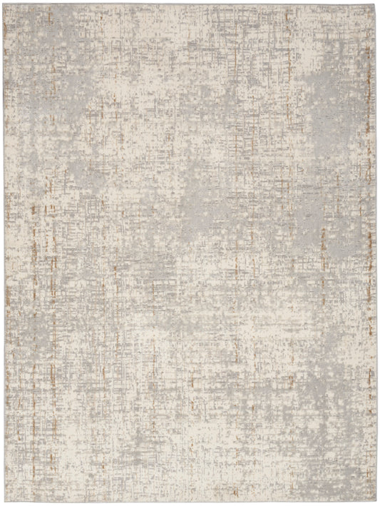 Rectangular abstract area rug in pale gray and beige with a distressed patchwork pattern and copper accents.
