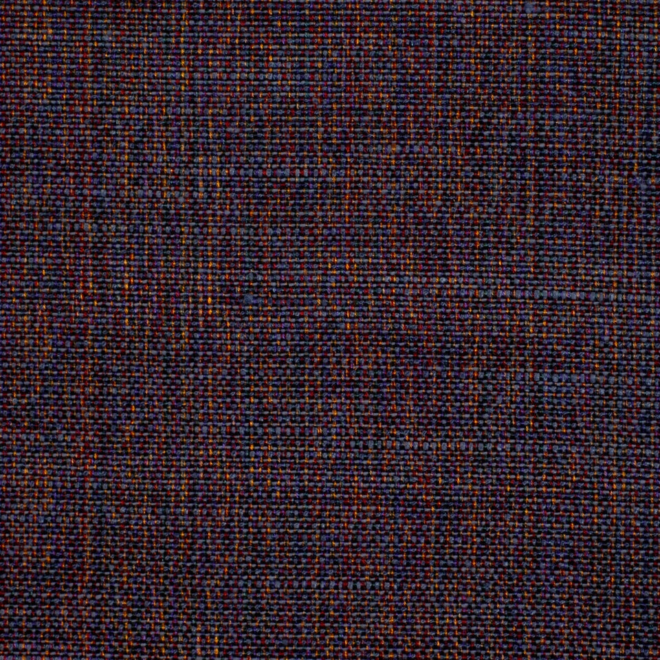 Dark tweed fabric close-up with navy, brown and orange specks; wool-blend, textured weave suitable for upholstery.