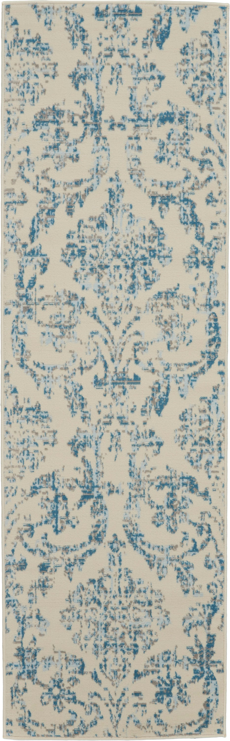 Cream-colored rectangular runner rug with blue distressed damask pattern and ornate floral motifs.