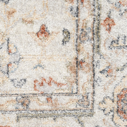 Close-up of a cream wool rug with blue & rust & tan floral border; traditional oriental design.