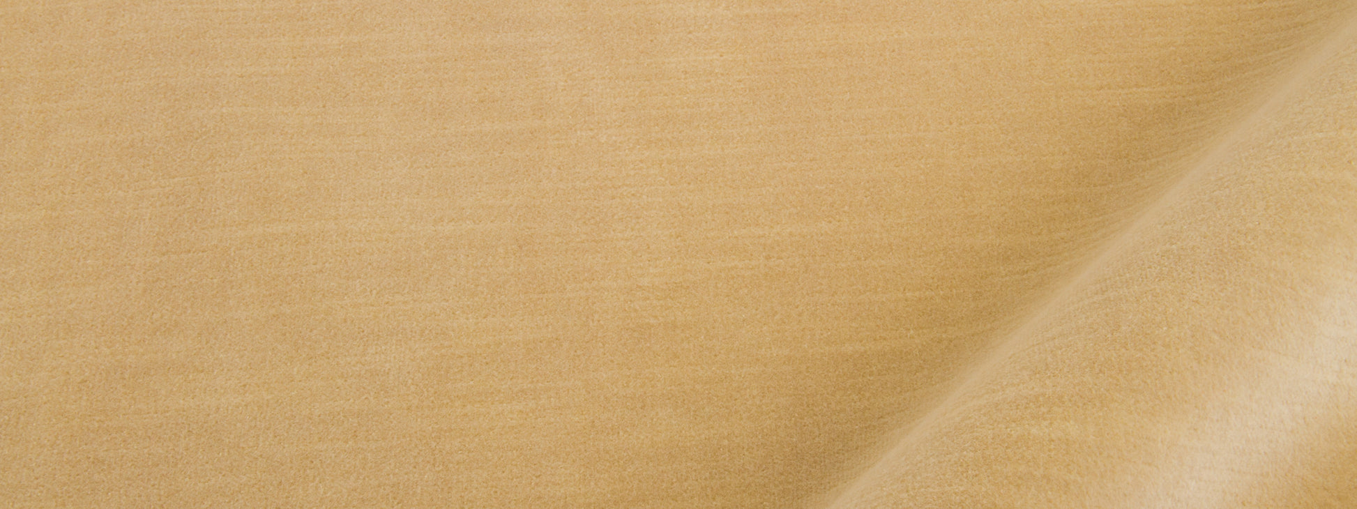 Beige linen-like fabric close-up with diagonal fold and subtle weave texture.
