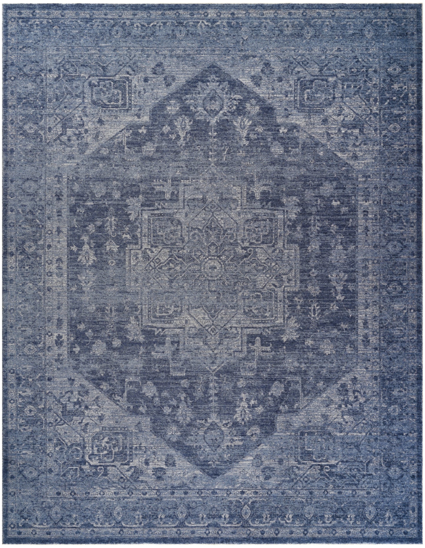 Blue distressed oriental area rug with a central medallion and ornate border.