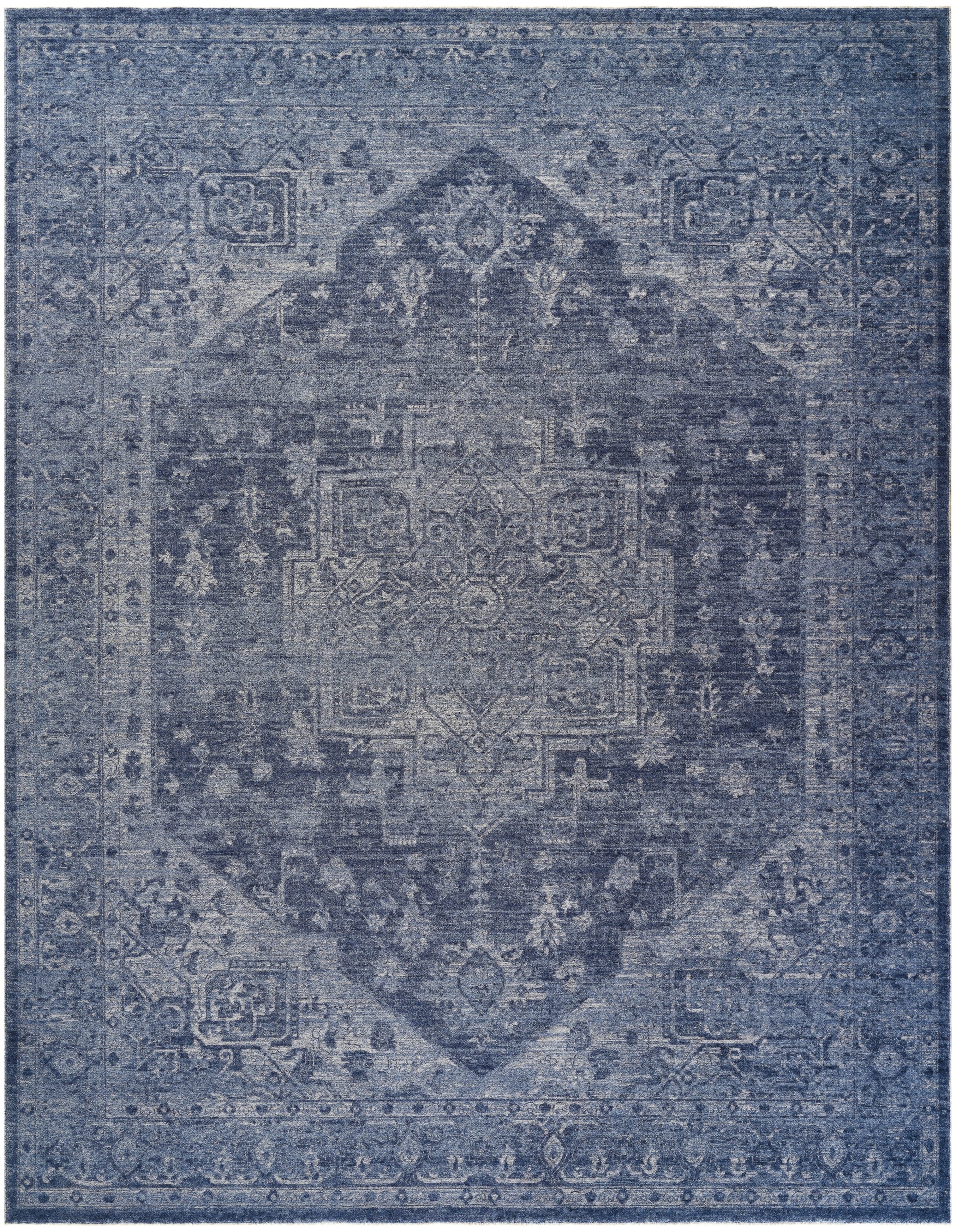 Blue distressed oriental area rug with a central medallion and ornate border.