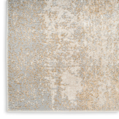 Rectangular rug with abstract gray and beige pattern; soft plush pile, 5' x 7', for modern living spaces.