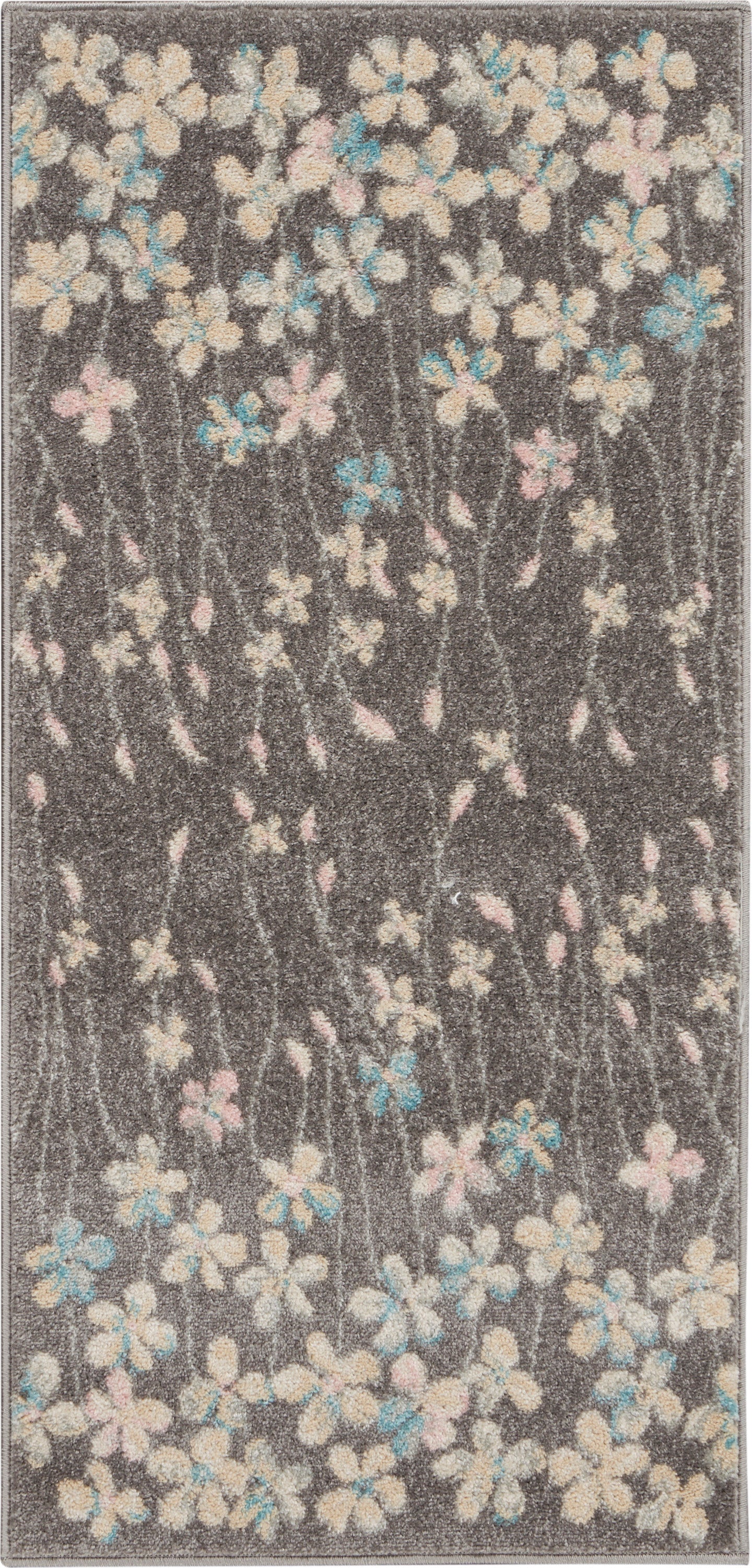 Dark gray shag rug with cream, pink, and blue floral blossoms and delicate stems.