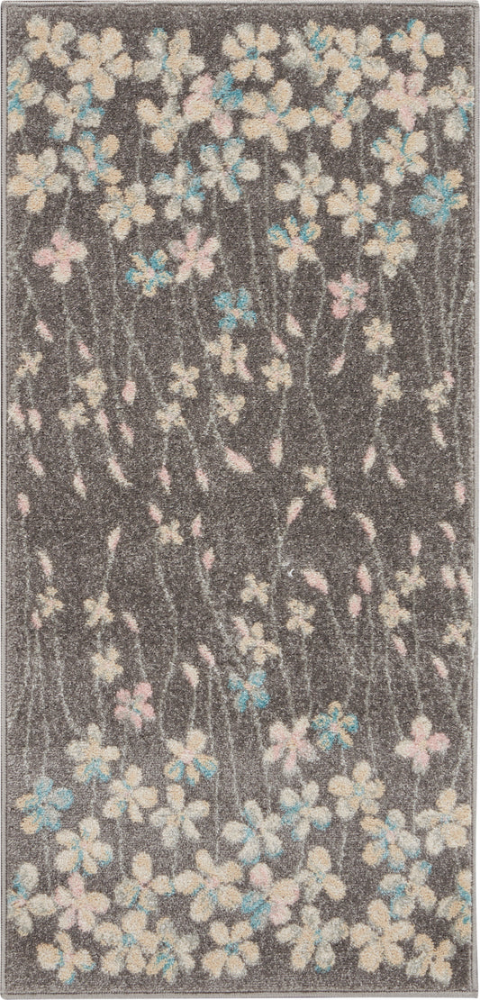 Dark gray shag rug with cream, pink, and blue floral blossoms and delicate stems.