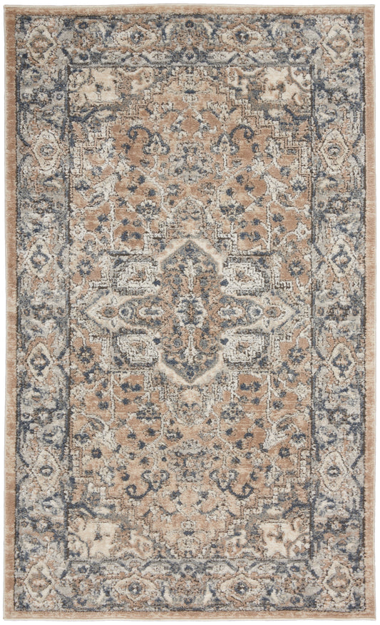 Rectangular farmhouse-style woven rug with beige/tan field, blue border and central medallion; floral motifs.
