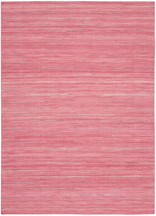 Pink flatweave rug with subtle horizontal pink stripes and a soft woven texture.