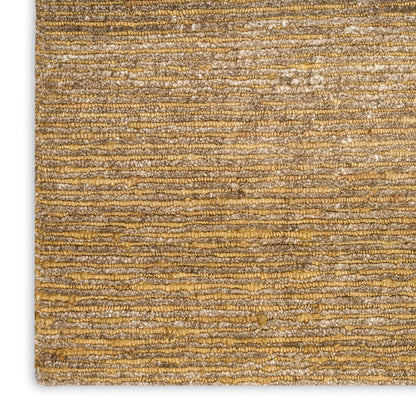 Close-up of a golden-brown striped woven area rug with textured loop pile.